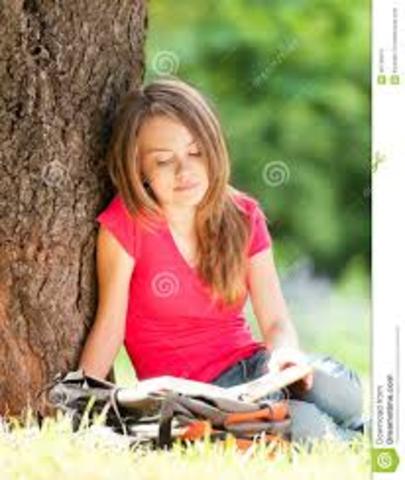 Read book in pasture to lure horse