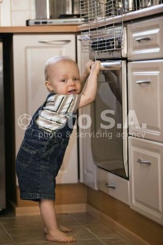Pulling self up to standing position