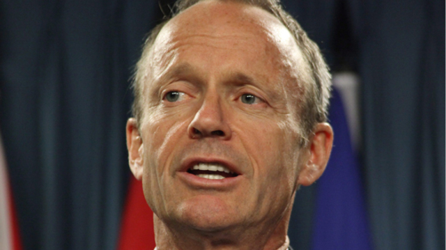 Day defends government