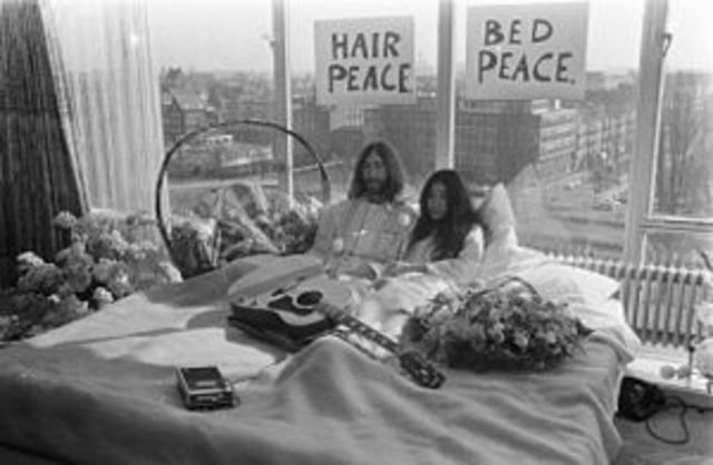 John and his wife protested for peace by staying in bed all day