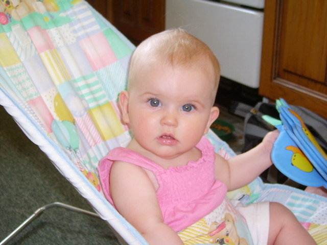 Sits up with support