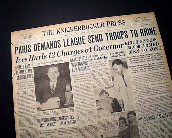 Hitler sends troops into rhineland a demilitarized area of Germany