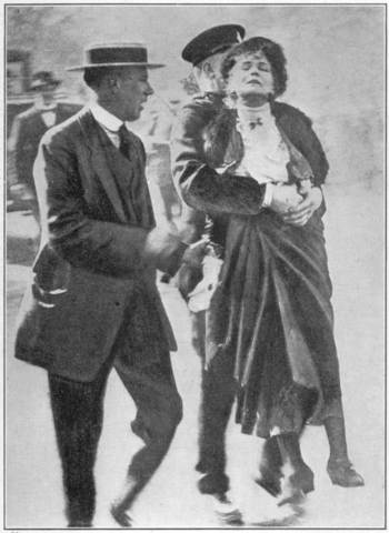 Inspector Wells conducting Mrs. Pankhurst to theHouse of Commons,