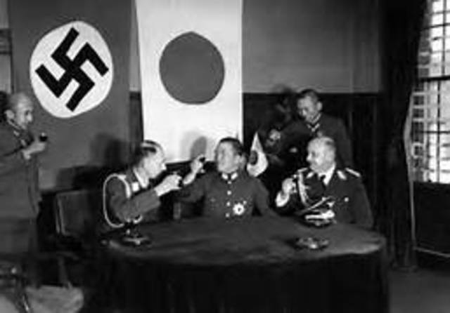 Germany, Italy, and Japan sign the Tripartite Pact.