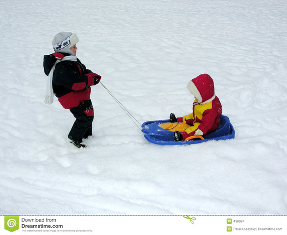 Jonas rides on sled with gabe
