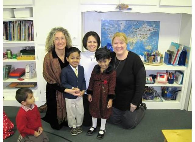 Sachita with her class teachers.