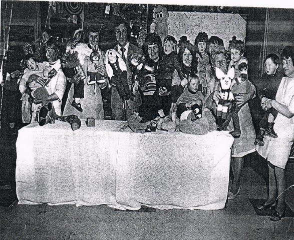 Ken Dodd presenting a donation