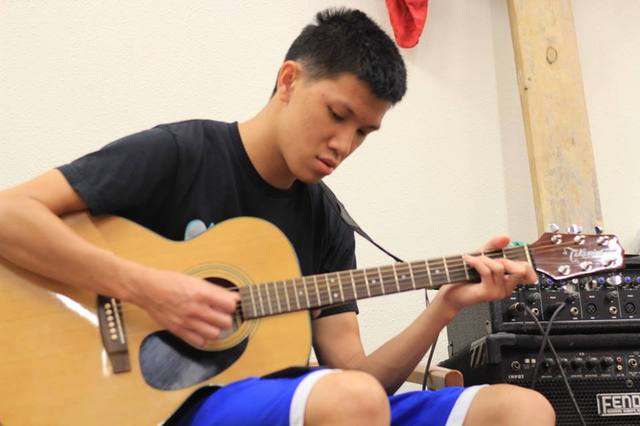 Learns to play both bass guitar and guitar