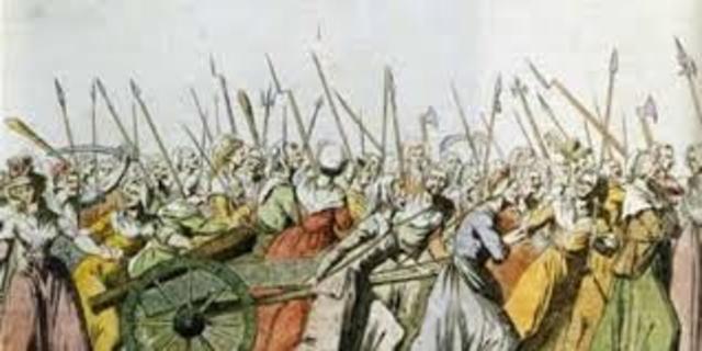 Working women from Paris march on Versailles and broke into the kings palace.