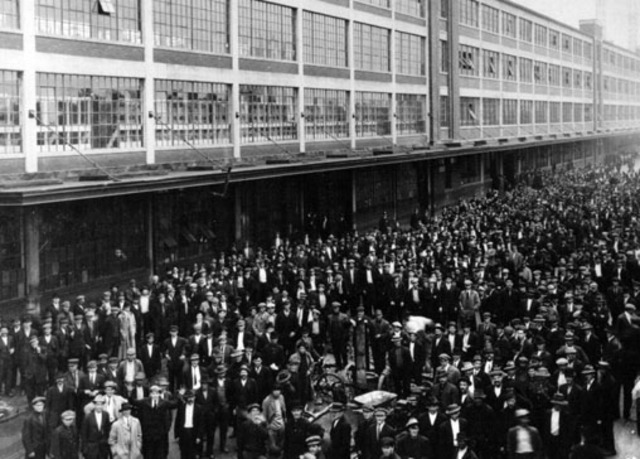 Henry Ford introduces the $5 a day living wage