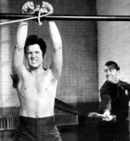 Rudy watches as Hans Hubermann is whipped