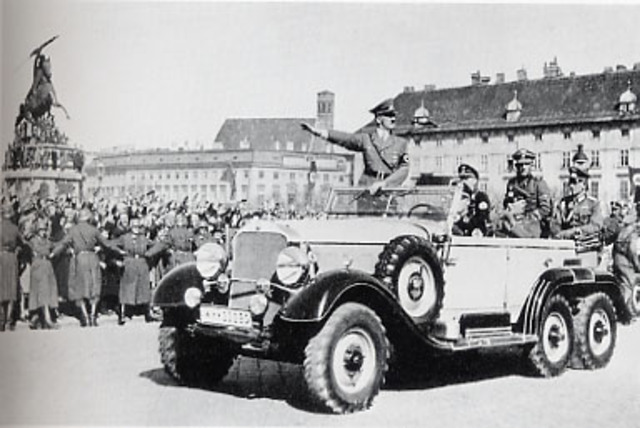 Hitler is welcomed into Austria and gives a speach from Vienna