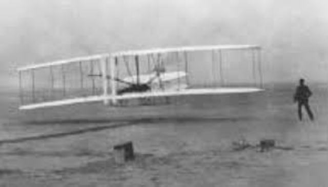 First controlled powered man carryed flight