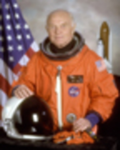 John Glenn returns to space on the Shuttle Discovery to test affects on aging