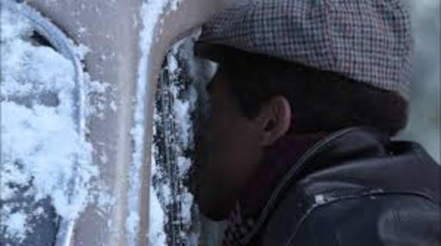 Byron getting his tongue stuck to the car