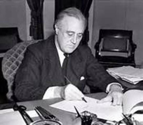 FDR signs Neutrality Act