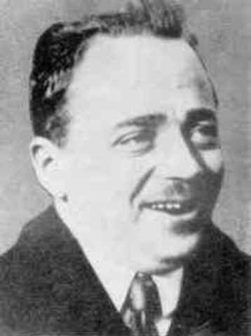 Nazi soldiers murder Austrian Chancellor Dollfuss.