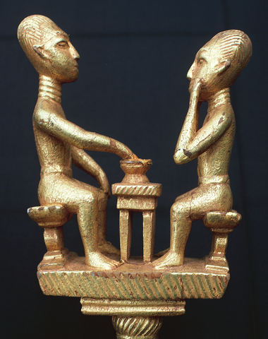 Linguist's staff of two men sitting at a table of food