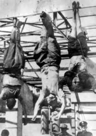 Mussolini is hanged by Italian partisans