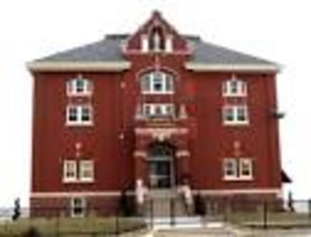 Where did Louis Riel go to school?