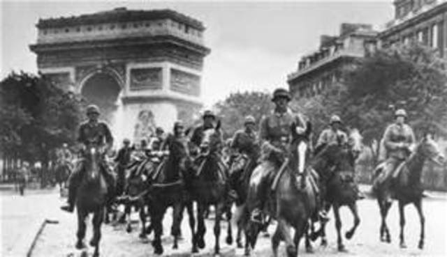 Germany invades France and forces it to surrender