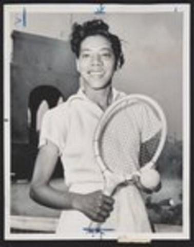 Althea Gibson becomes the first African American to win a title