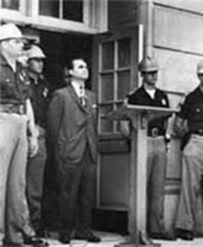 Alabama Governor, George Wallace refuses to integrate public schools in Huntsville and Birmingham.