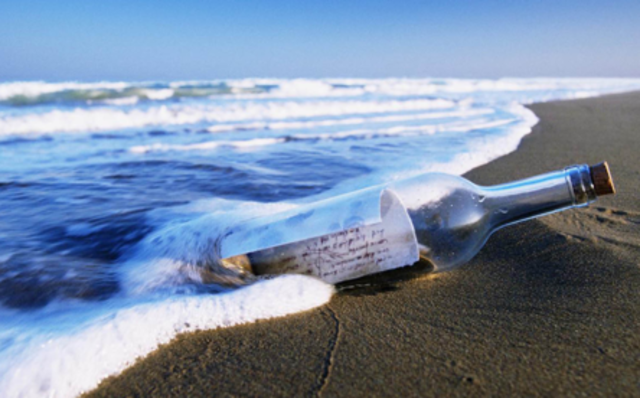 The Hokie’s write a note in the sand