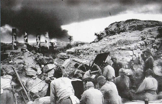 Japanese begin a heavy bombing and artillery barrage