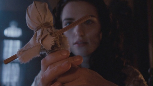 Elizabeth is taken away because of Mary's poppet