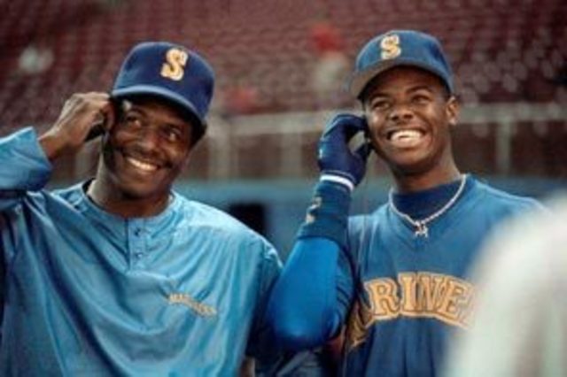 Ken Griffey Sr. and Jr. play on same team.