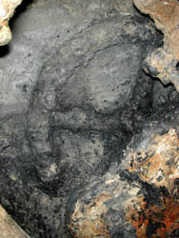 A possible gear or brake wheel is uncovered.