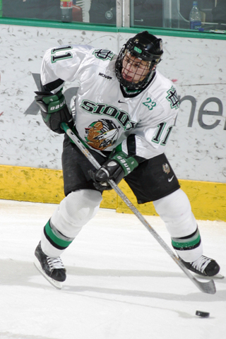 Zach starts playing collage hockey for U.N.D.