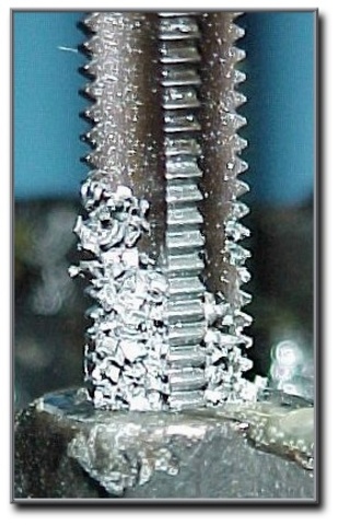 4.  Apply cutting oil to the tap