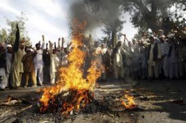 Muslims attacked Buddhist villages after a Koran was burnt.
