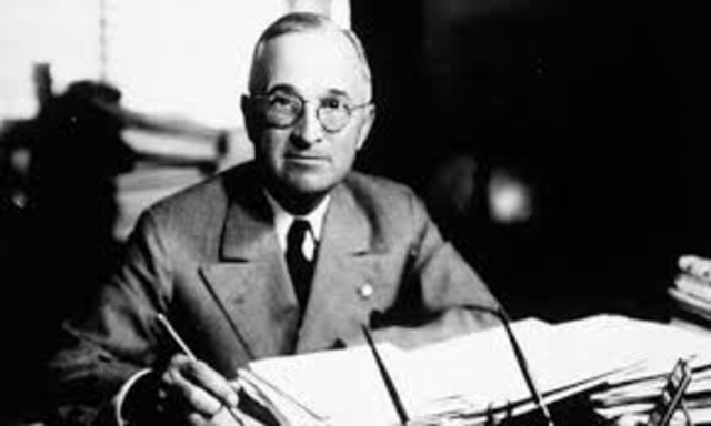 President Harry S. Truman helps out