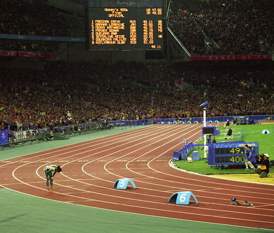 Cathy Freeman after the 400 metre at the Sydney Olympics, 2000. Photograph Michael Amendolia. Courtesy State Library of New South Wales
