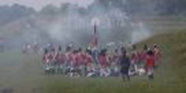 When Joan was three England's King HenryV attacked France and won.