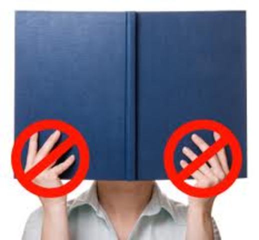 Mildred finds book and turns Motage in.