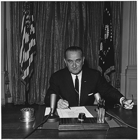 President Johnson signs resolution