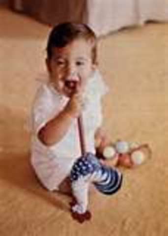 John Fitzgerald Kennedy, Jackie's son, is born.
