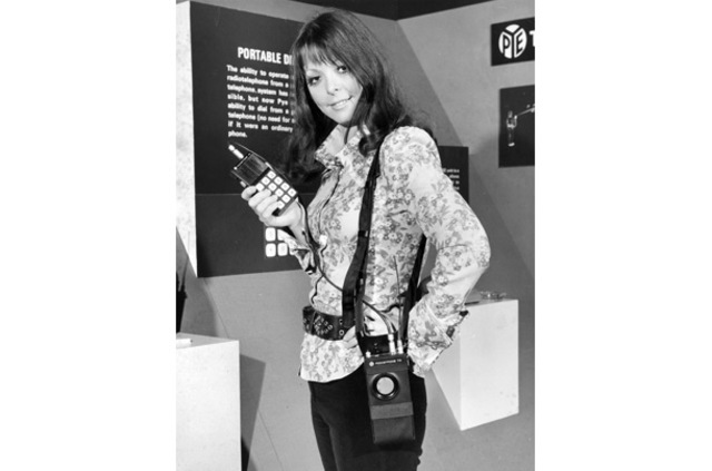 PortableA model shows off a unit that could dial into telephone systems, displayed at a London exhibition entitled, "Communications Today, Tomorrow and the Future."