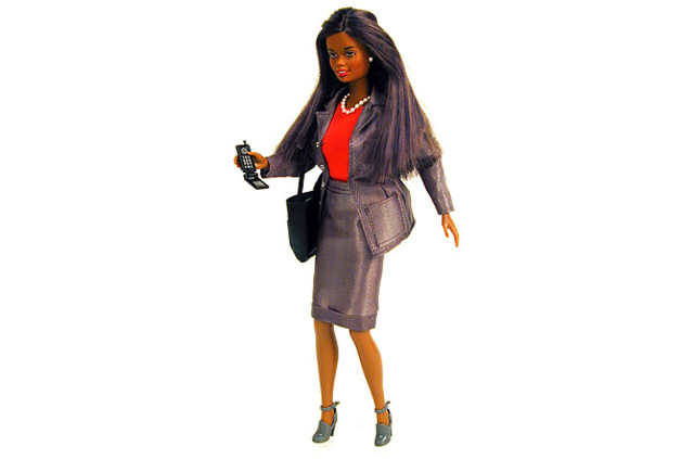 In FashionMattel's Barbie is outfitted with pearls, a business suit and a cell phone.
