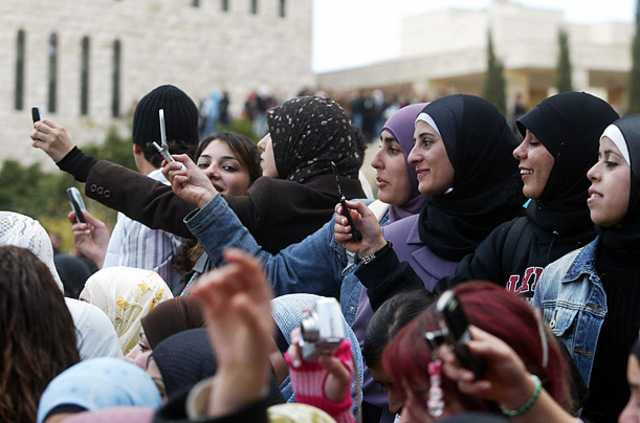 Historic MomentPalestinian students at a Ramallah University photograph physicist Steven Hawking, who has arrived to give a lecture.