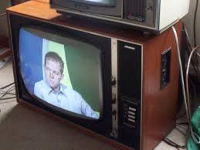 First colour television broadcasting begins