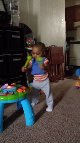 Little brother taking first steps