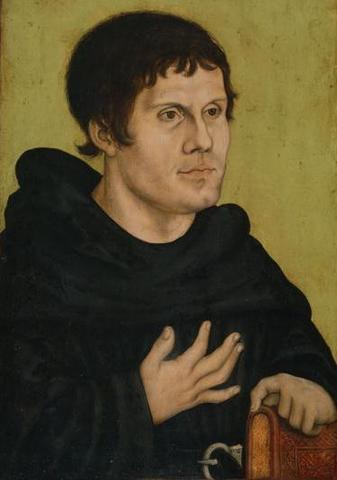 German Monk Martin Luther Nails His NInety-Five Theses to the Church Door