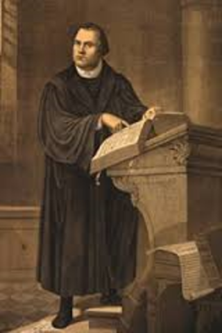 German Monk Martin Luther nails his ninety-five theses to the church door