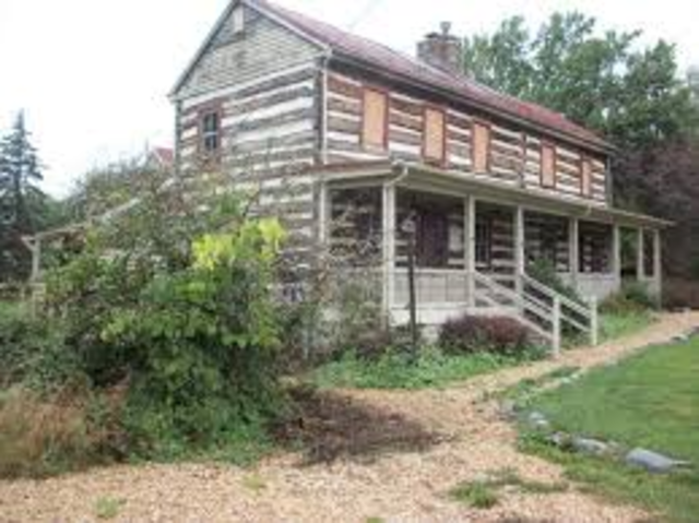 Scandinavian Log Cabin with chinking and gable roof