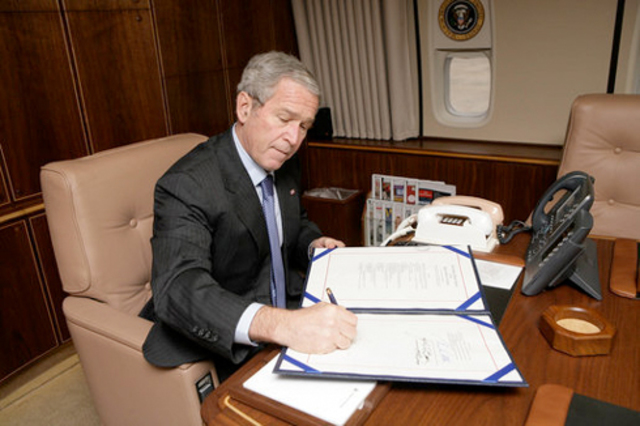 Bush Signs Law to Widen Reach for Wiretapping